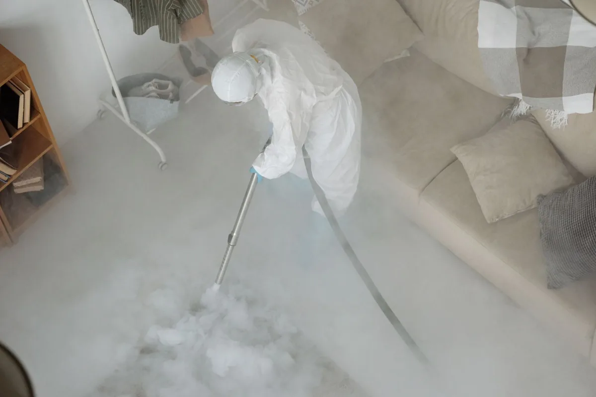 Biohazard cleanup technician in protective equipment, Abbeville, AL